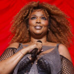 Lizzo Slays in Bodysuit and Fishnets in Latest Video Following