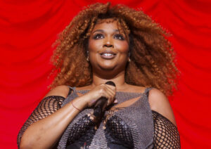 Lizzo Slays in Bodysuit and Fishnets in Latest Video Following